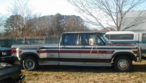 Black 1980 Ford F150 flare side, known as Darth, parked in a driveway, an entrant in the 2020 Virtual Truck Show.