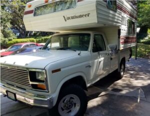 White 1981 Ford F250 Custom regular cab with a suspension lift and aftermarket wheels, an entrant in the 2020 Virtual Truck Show.