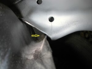 A series of photos showing a frame crack near the steering box, the grinding and welding process, and the final reinforced and painted chassis on a rotisserie.