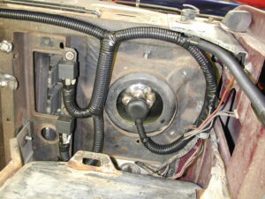 Photographs of a custom-built headlight wiring harness using relays and an auto-reset circuit breaker mounted near the starter solenoid.
