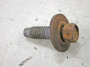 A close-up of a weathered M8-1.25mm x 28mm screw with a captive washer, identified as Ford part number N606689-S2.