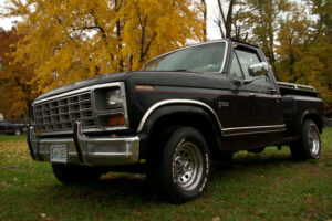 A black 1983 Ford F100 short bed with a 351 Cleveland V8 and a 9-inch rear end, featured as Entrant #24 in the 2020 Virtual Truck Show.