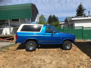 A beautifully restored 1981 Ford Bronco with fresh paint and collector plates, featured as Entrant #15 in the 2020 Virtual Truck Show.