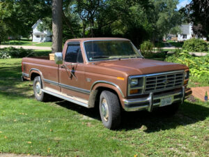 Brown and tan 1981 Ford F350 XLT regular cab survivor with factory hubcaps, an entrant in the 2020 Virtual Truck Show.