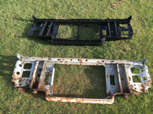 A scanned parts table for the 16138 Support Assy. (Radiator), listing years 80/86, model restrictions, part numbers like E5TZ 16138-C, and descriptions regarding 29-inch openings.