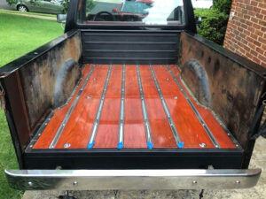 1985 Ford F150 Flareside with a restored wood bed and visible paint patina, an entrant in the 2020 Virtual Truck Show.